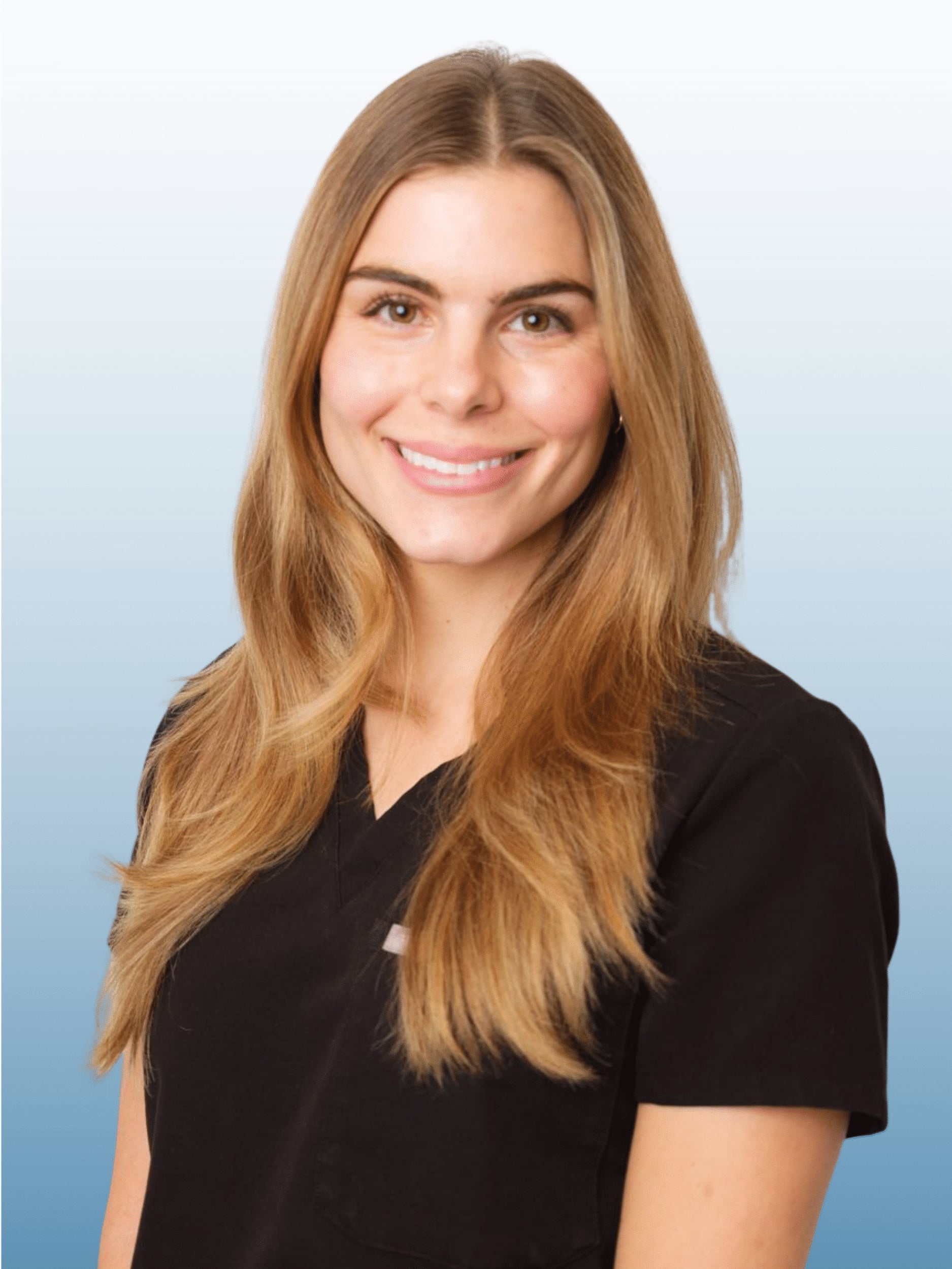 Portrait of Sarah Storniolo, NP, in black scrubs